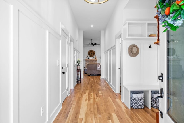 hallway featuring recessed lighting and light wood-style flooring