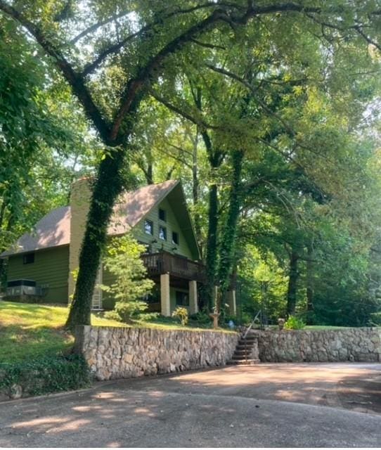view of property exterior with a chimney
