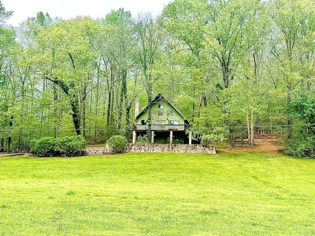 view of yard featuring a wooded view