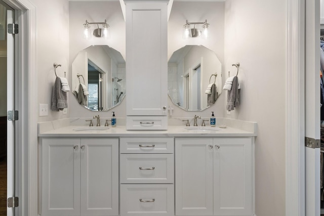 full bathroom with double vanity and a sink