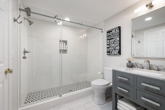 bathroom with toilet, recessed lighting, tile patterned flooring, a shower stall, and vanity