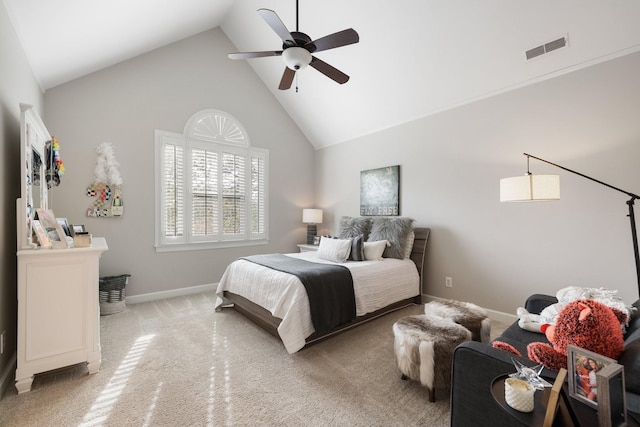 carpeted bedroom with baseboards, visible vents, high vaulted ceiling, and ceiling fan