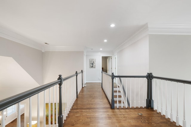 hall with wood finished floors, recessed lighting, and crown molding
