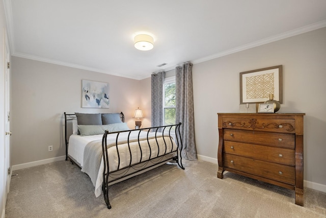 carpeted bedroom with baseboards, crown molding, and visible vents