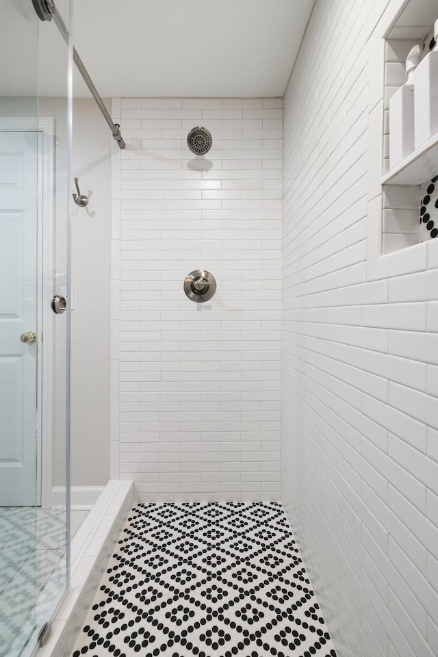 full bath with a shower stall