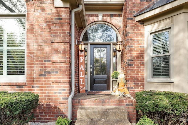 property entrance with brick siding