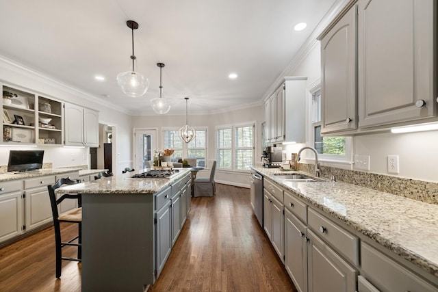 kitchen with stainless steel appliances, a sink, gray cabinets, open shelves, and a kitchen island