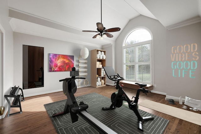 exercise room with baseboards, lofted ceiling, a ceiling fan, wood finished floors, and ornamental molding