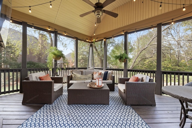 sunroom with ceiling fan and an outdoor hangout area