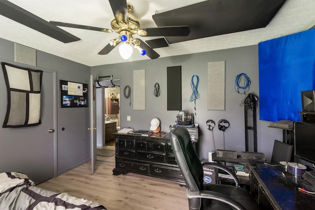 office area featuring a ceiling fan and wood finished floors