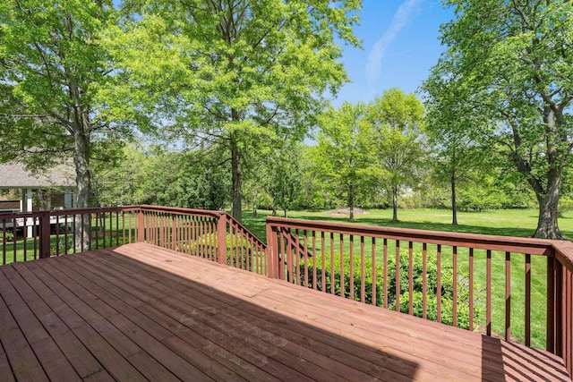 wooden terrace with a yard