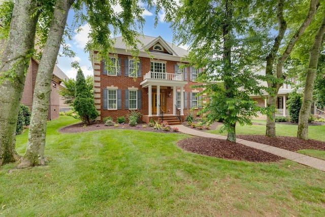 638 Band Dr, Franklin, TN 37064 - colonial house featuring brick siding, a front yard, and a balcony