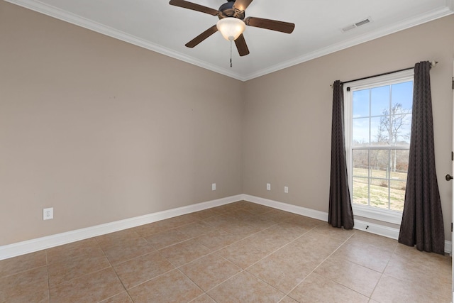 spare room with ornamental molding, a healthy amount of sunlight, visible vents, and light tile patterned floors