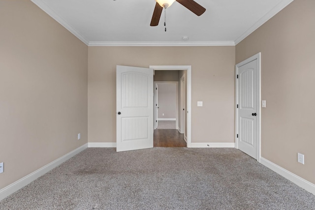 unfurnished bedroom featuring baseboards, carpet, and ornamental molding