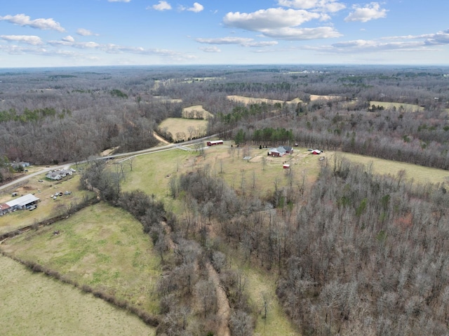 aerial view featuring a rural view and a view of trees