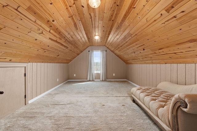 additional living space featuring lofted ceiling, carpet, wood walls, and wood ceiling