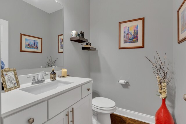 155 Telavera Dr, White House, TN 37188 - bathroom with toilet, vanity, wood finished floors, and baseboards