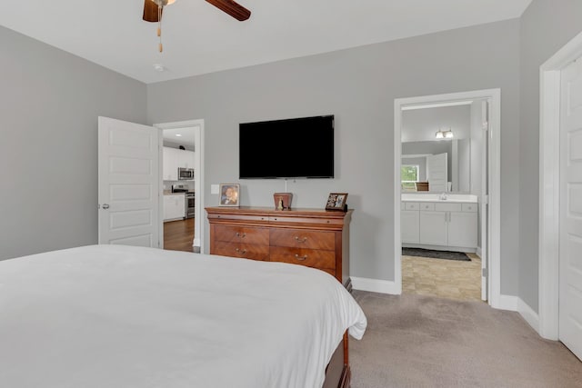 155 Telavera Dr, White House, TN 37188 - bedroom with baseboards, ceiling fan, connected bathroom, and light colored carpet