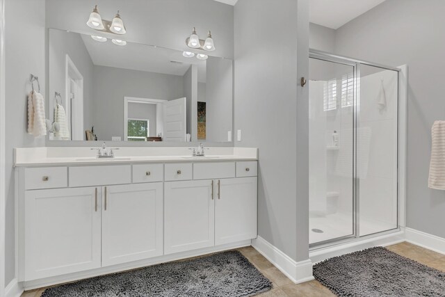155 Telavera Dr, White House, TN 37188 - bathroom featuring baseboards, a stall shower, and a sink