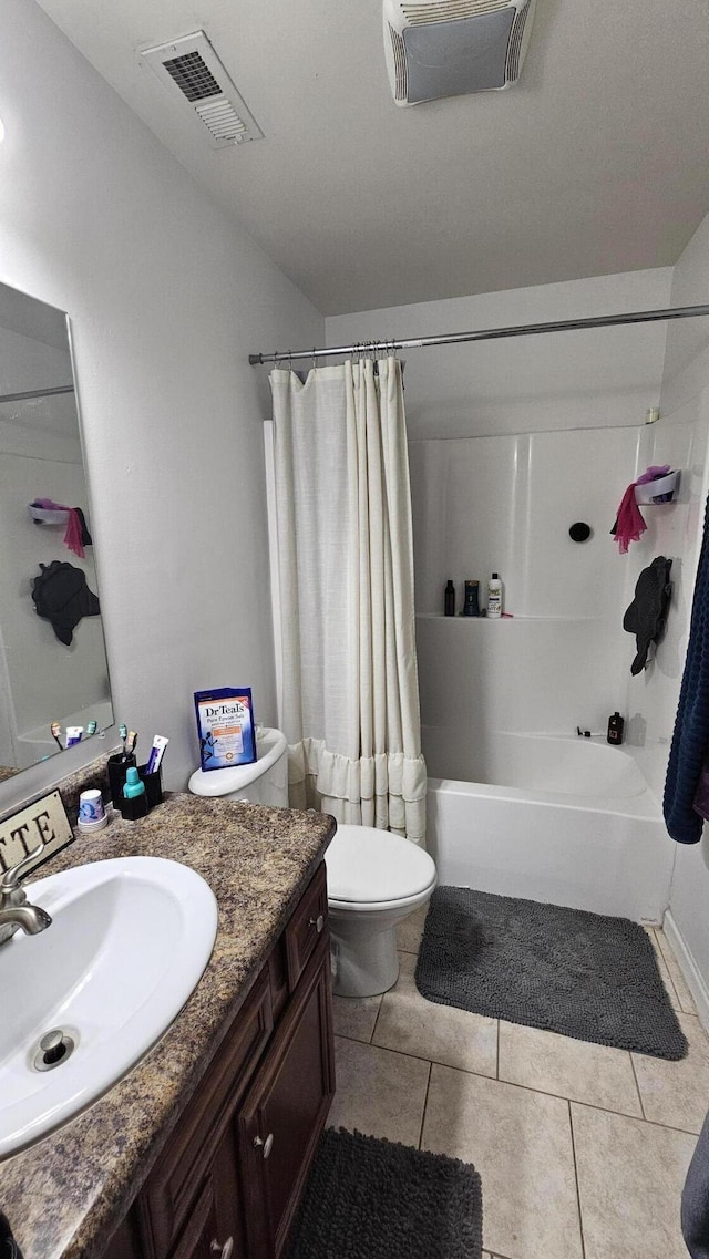 bathroom featuring tile patterned floors, vanity, visible vents, toilet, and shower / bath combo with shower curtain