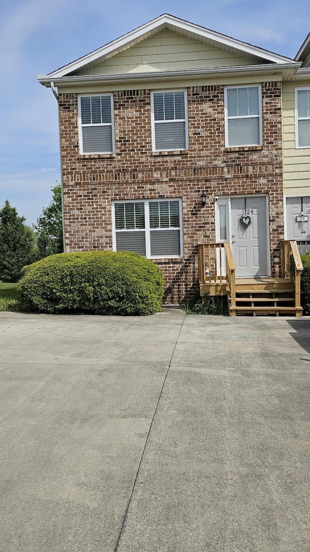 view of property featuring brick siding