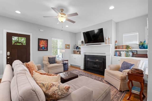 5604 Kentucky Ave, Nashville, TN 37209 - living area with a fireplace with flush hearth, ceiling fan, recessed lighting, and light wood-type flooring
