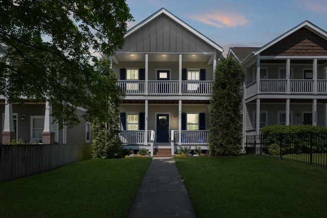 5604 Kentucky Ave, Nashville, TN 37209 - view of front of property featuring board and batten siding, a porch, a front lawn, and fence