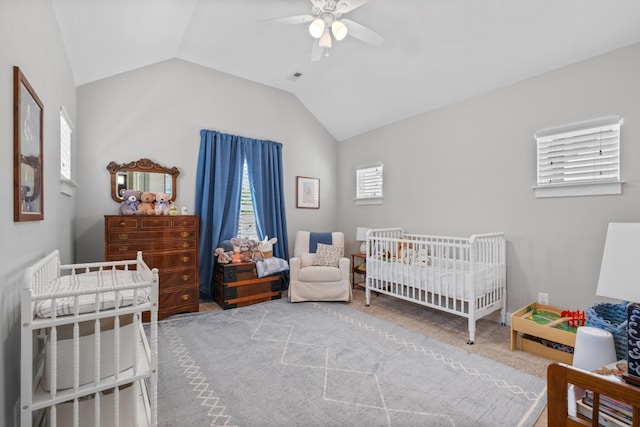 5604 Kentucky Ave, Nashville, TN 37209 - bedroom featuring a nursery area, vaulted ceiling, ceiling fan, carpet, and visible vents
