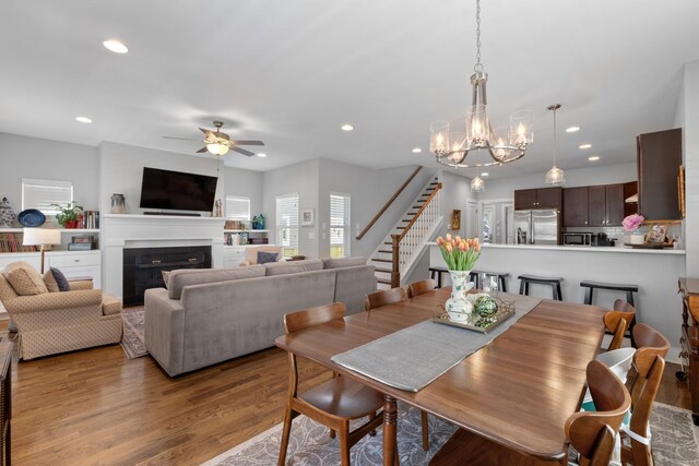 5604 Kentucky Ave, Nashville, TN 37209 - dining area with recessed lighting, stairway, and ceiling fan with notable chandelier