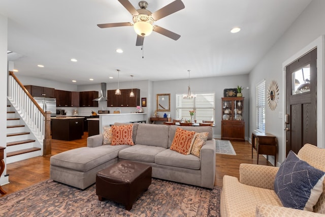 5604 Kentucky Ave, Nashville, TN 37209 - living room with recessed lighting, stairway, wood finished floors, and ceiling fan with notable chandelier