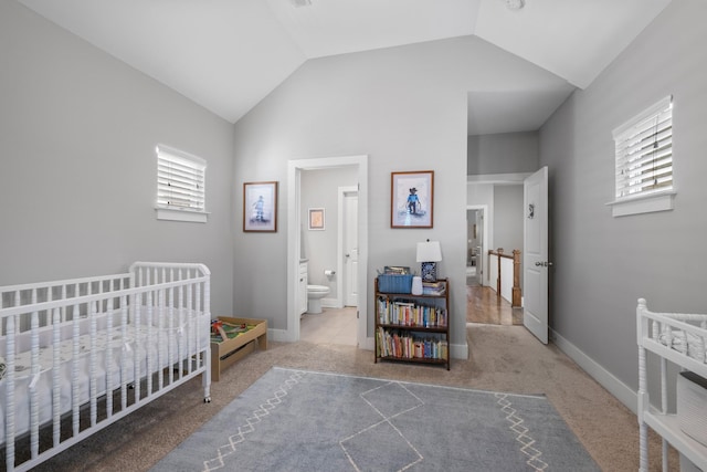 5604 Kentucky Ave, Nashville, TN 37209 - carpeted bedroom with vaulted ceiling, a crib, and baseboards