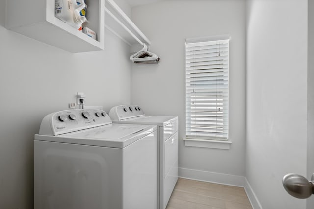5604 Kentucky Ave, Nashville, TN 37209 - clothes washing area with washing machine and dryer, baseboards, and laundry area