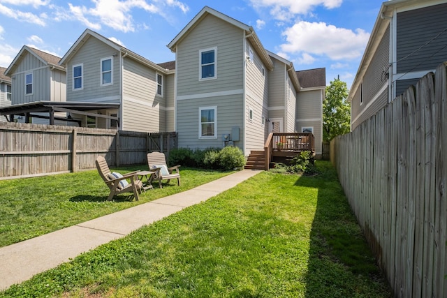 5604 Kentucky Ave, Nashville, TN 37209 - back of property featuring a wooden deck, a yard, and a fenced backyard