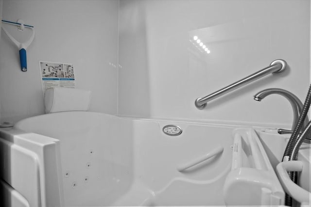 interior space with a jetted tub