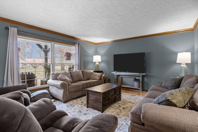 living area featuring a textured ceiling, light wood-style flooring, a wealth of natural light, and ornamental molding