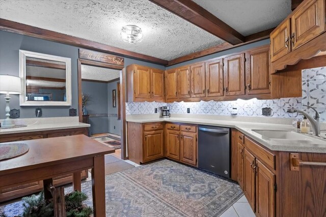 kitchen with a textured ceiling, a sink, tasteful backsplash, dishwashing machine, and brown cabinets