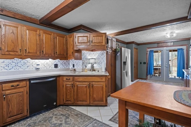 kitchen with a textured ceiling, brown cabinetry, stainless steel fridge with ice dispenser, french doors, and dishwashing machine