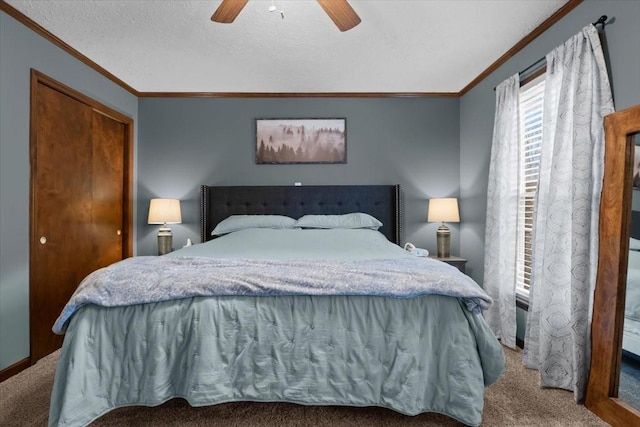 bedroom with a closet, a ceiling fan, ornamental molding, and carpet