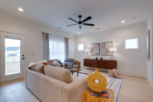 living room with recessed lighting, light wood-type flooring, visible vents, and ceiling fan