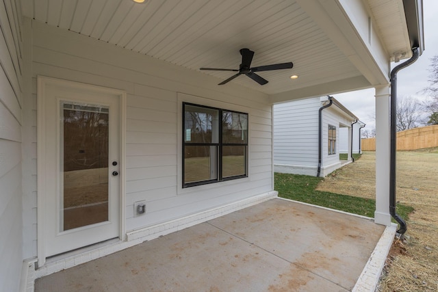 view of patio featuring fence and a ceiling fan