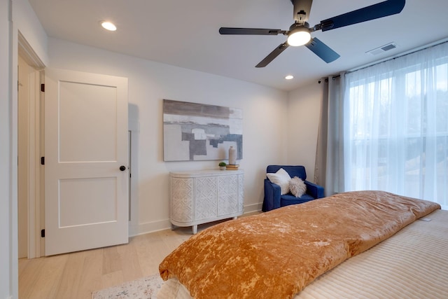 bedroom with recessed lighting, light wood finished floors, visible vents, a ceiling fan, and baseboards