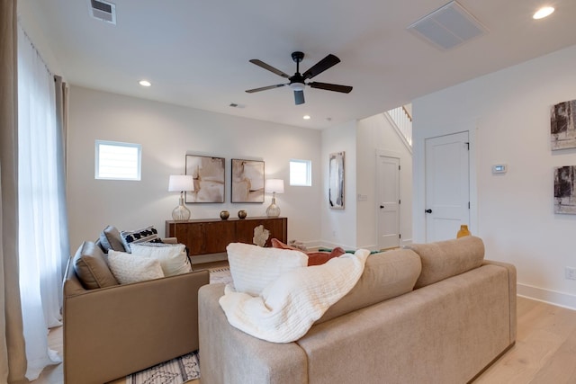 living room with a ceiling fan, light wood-style flooring, visible vents, and recessed lighting