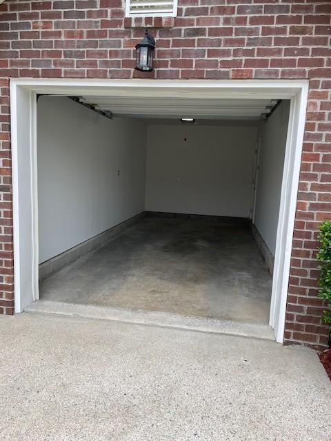 garage featuring driveway