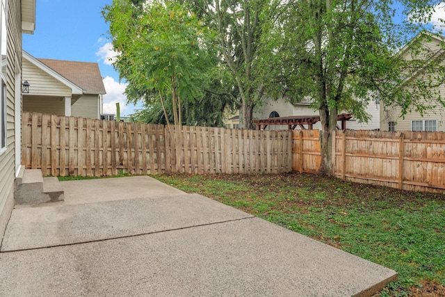 fenced backyard featuring a patio