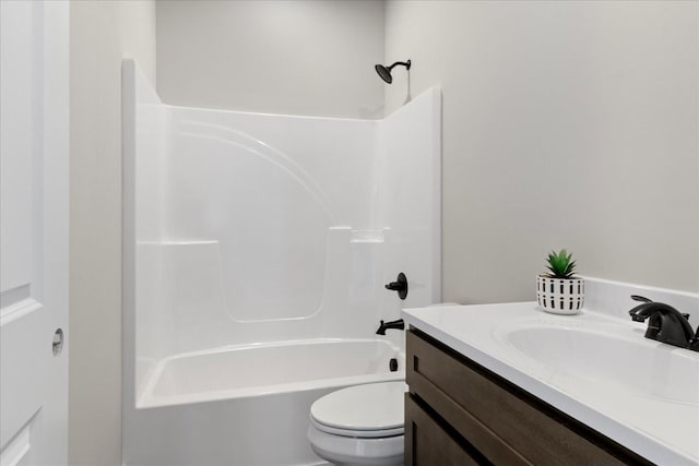 full bathroom featuring bathing tub / shower combination, vanity, and toilet
