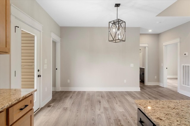 unfurnished dining area featuring recessed lighting, visible vents, light wood finished floors, and baseboards