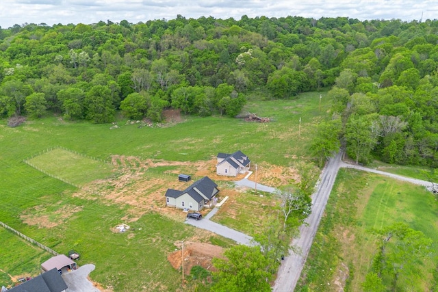 birds eye view of property with a rural view and a forest view