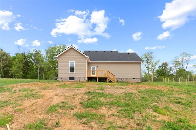 rear view of house featuring a wooden deck and crawl space