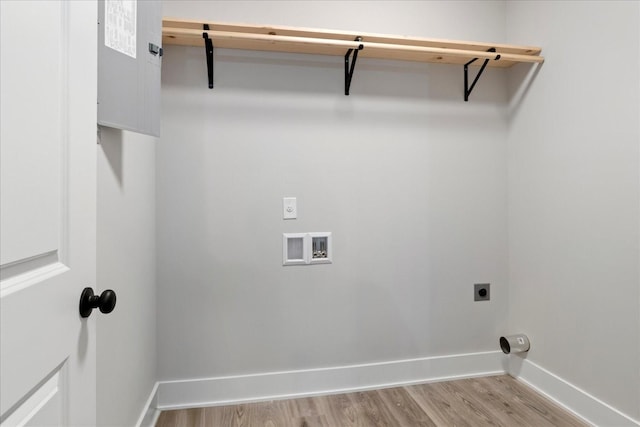 washroom featuring light wood finished floors, laundry area, hookup for a washing machine, baseboards, and electric dryer hookup