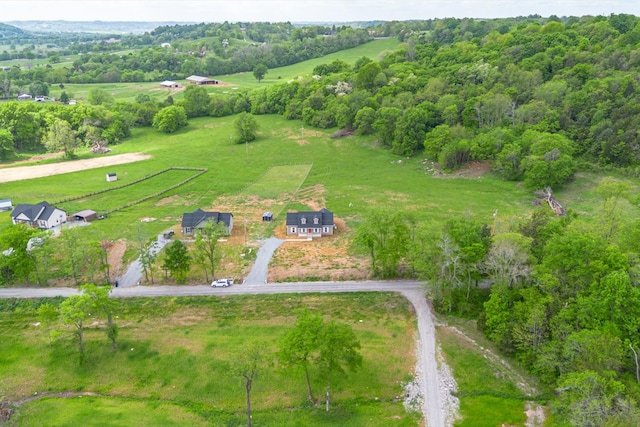 birds eye view of property with a rural view